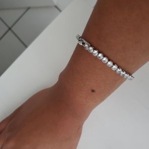 Brand New 18kt white gold tennis plated bracelet made with swarsoki  crystals